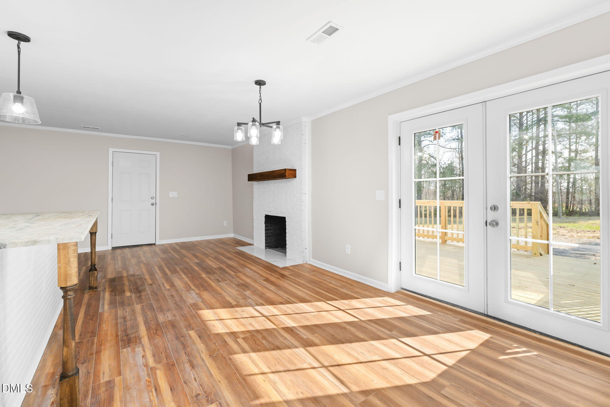 426 Rooker Dairy Road Norlina, NC 27563 - Photo 11 of 33 a view of empty room with wooden floor and fan