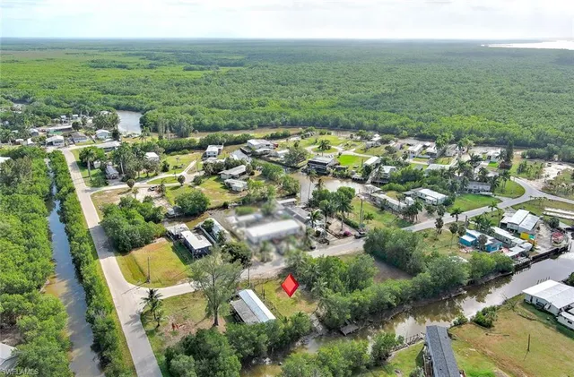 an aerial view of residential house with outdoor space and swimming pool