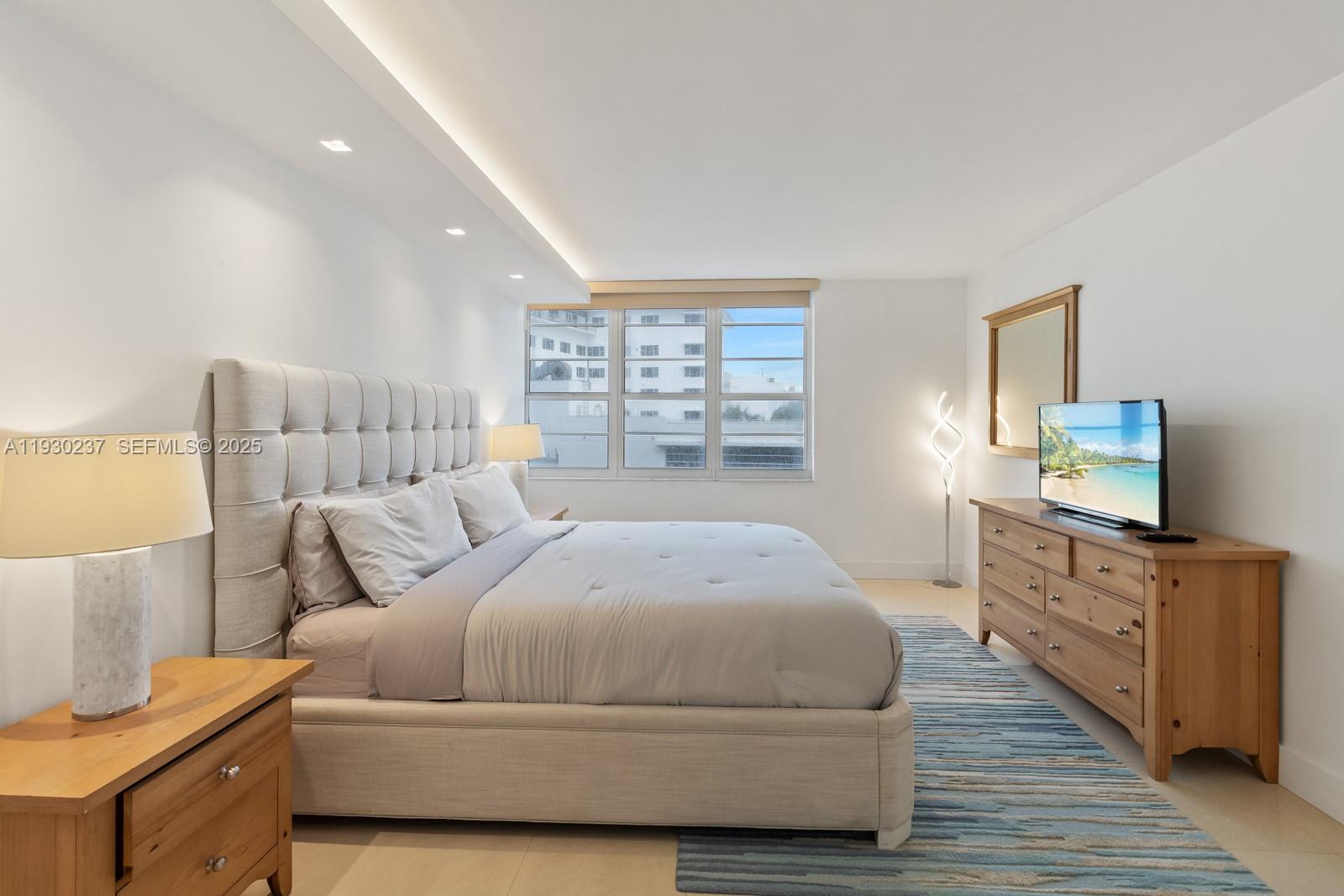 100 Lincoln Road, Unit 543 Miami Beach, FL 33139 - Photo 13 of 17 a bedroom with a bed and wooden floor