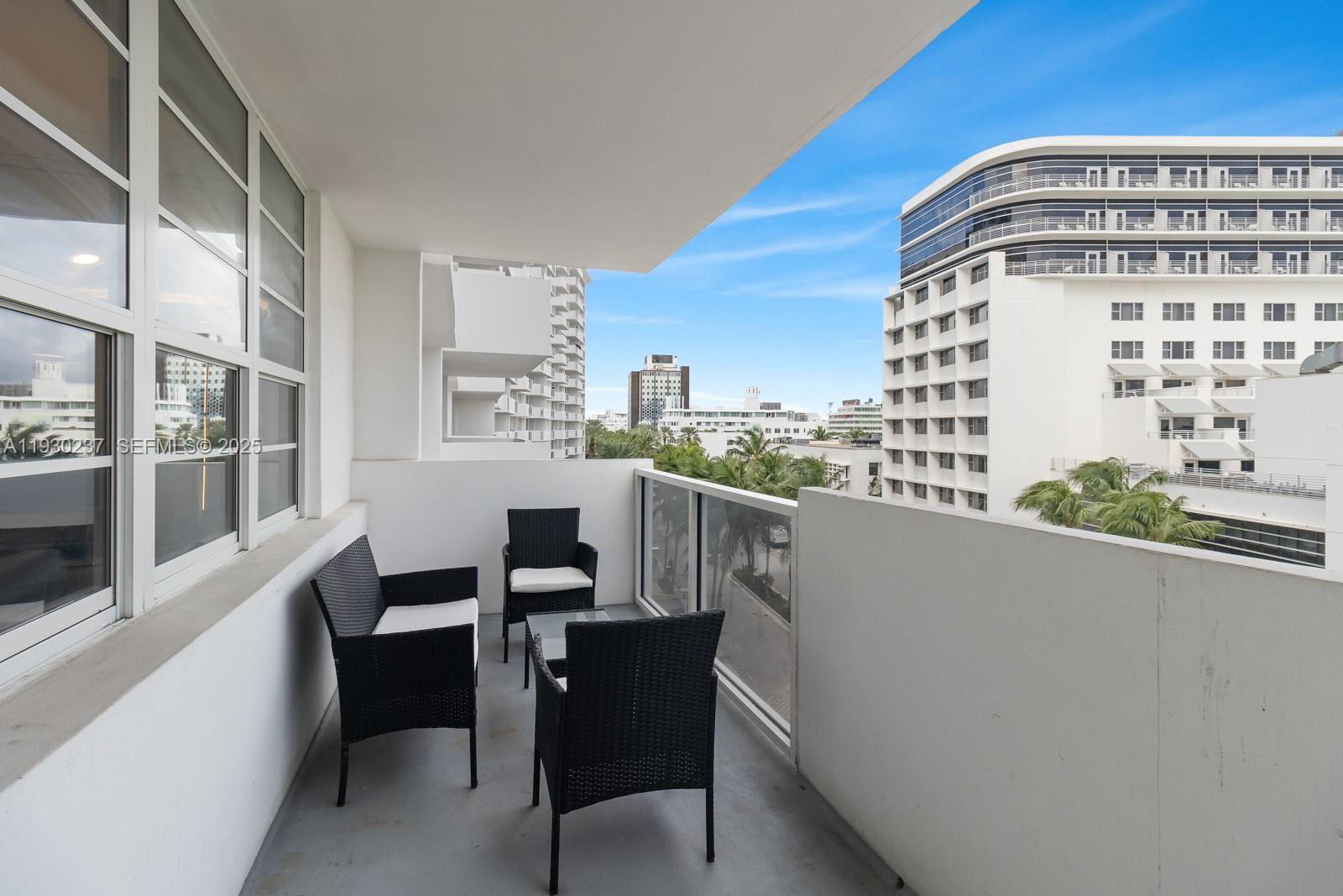 100 Lincoln Road, Unit 543 Miami Beach, FL 33139 - Photo 7 of 17 a view of a balcony with chairs
