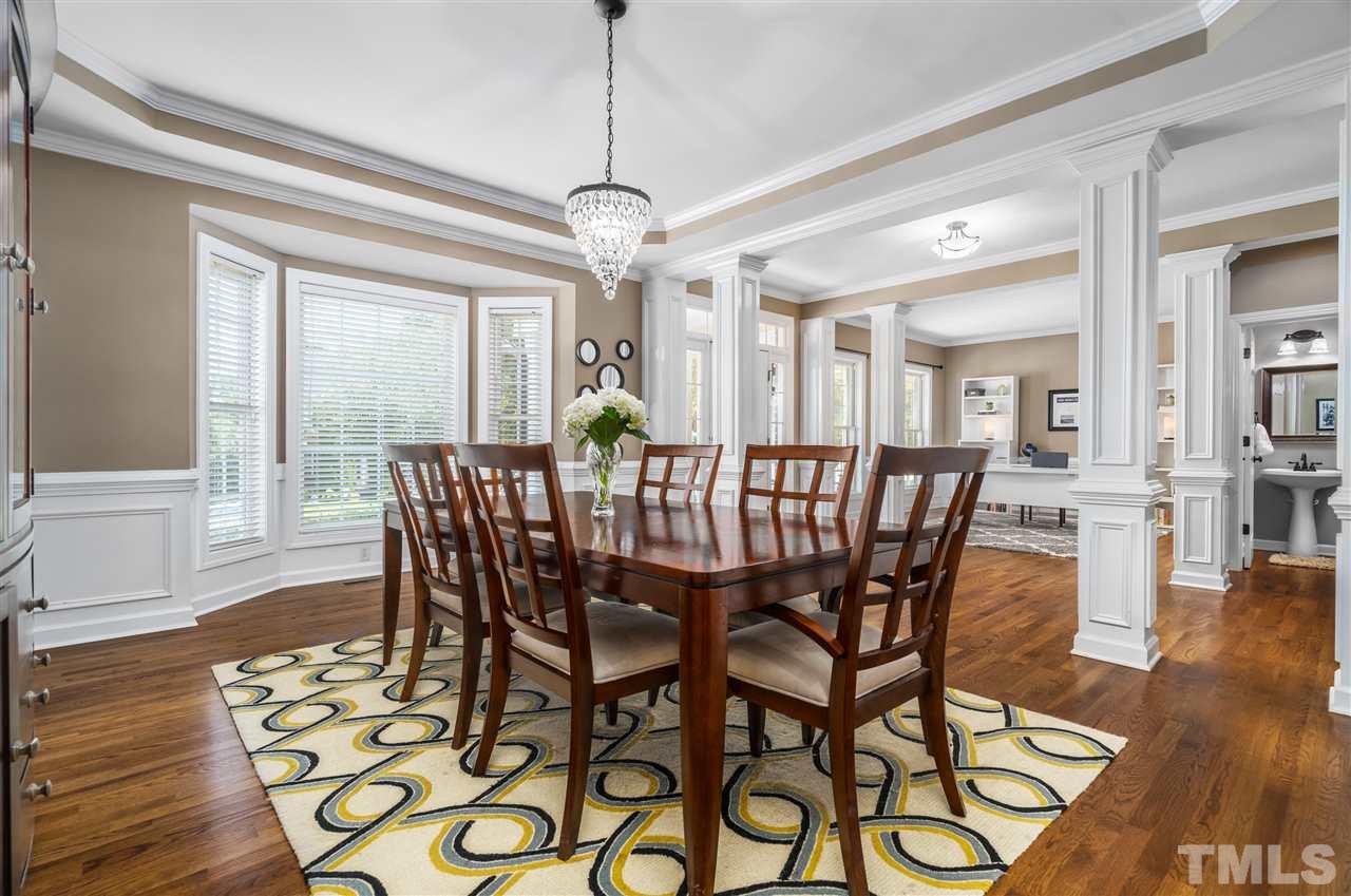 1520 Wood Spring Court Raleigh, NC 27614 - Photo 8 of 30 a view of a dining room with furniture wooden floor and chandelier