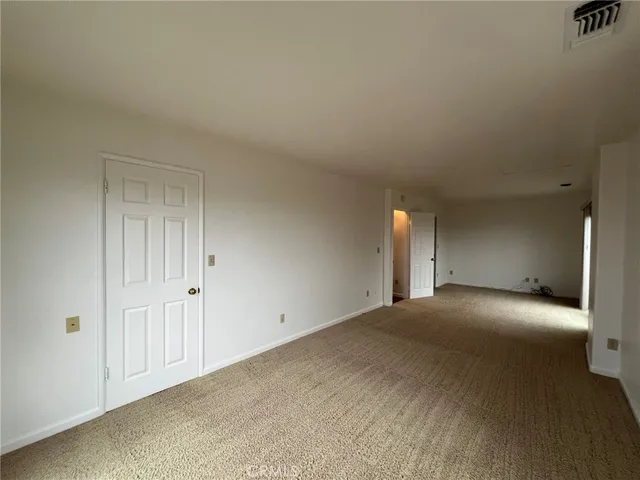 a view of a livingroom with furniture and staircase