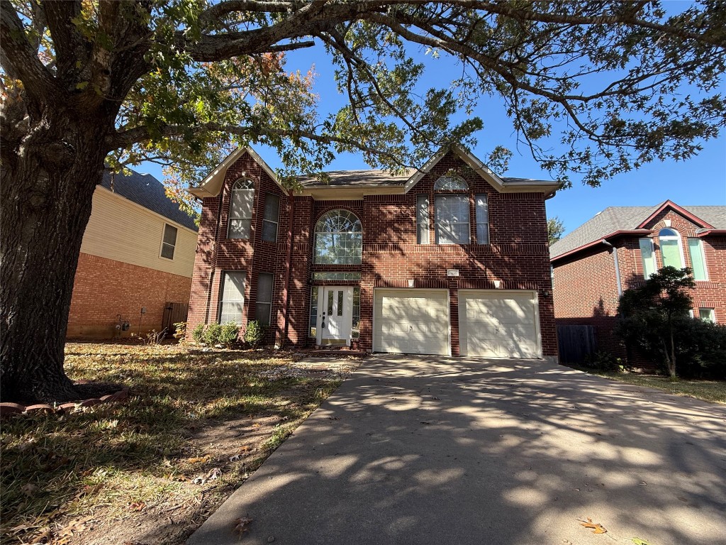 2438 Falcon Drive Round Rock, TX 78681 - Photo 1 of 18 a house with trees in the background