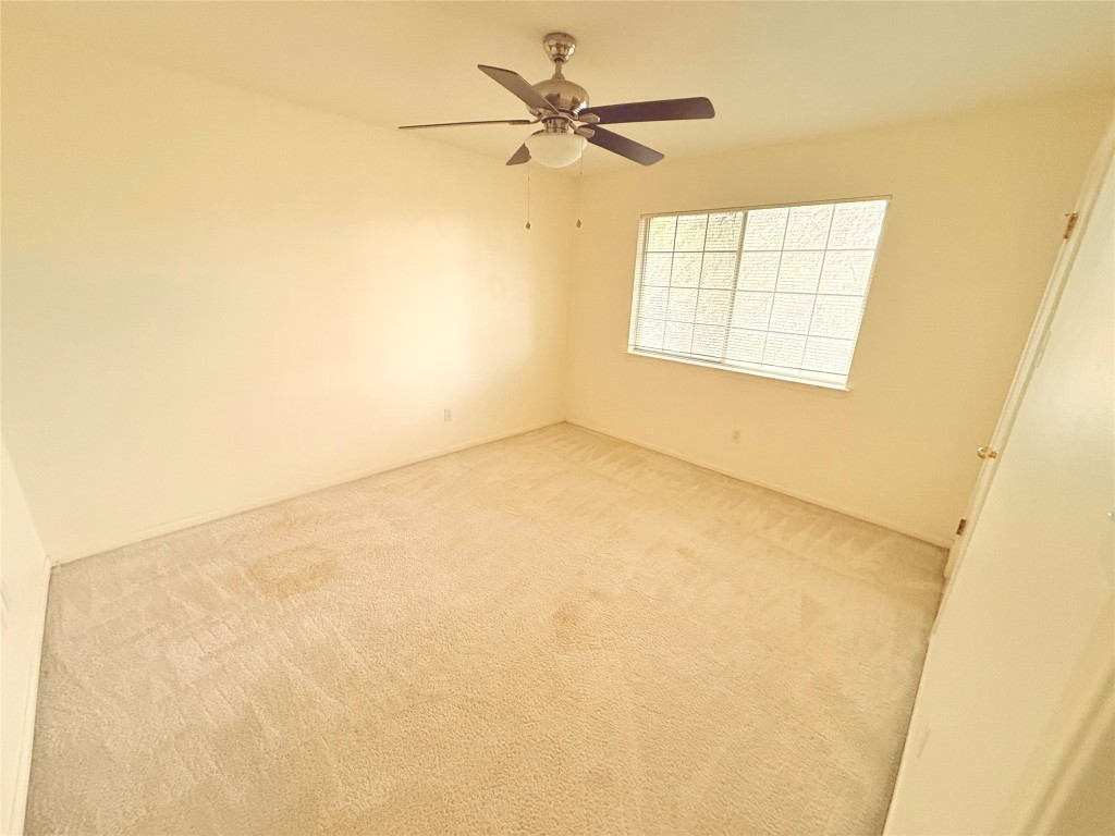 2438 Falcon Drive Round Rock, TX 78681 - Photo 12 of 18 a view of an empty room with a window