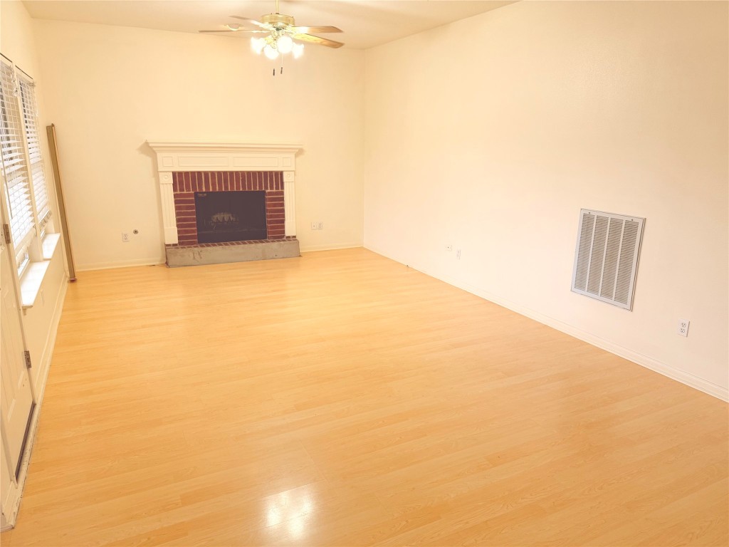 2438 Falcon Drive Round Rock, TX 78681 - Photo 6 of 18 a view of empty room with a fireplace