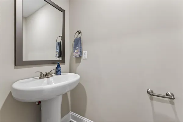 a bathroom with a sink and mirror