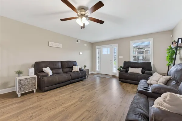 a living room with furniture and a large window