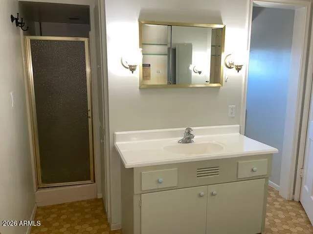 a bathroom with a sink and a mirror