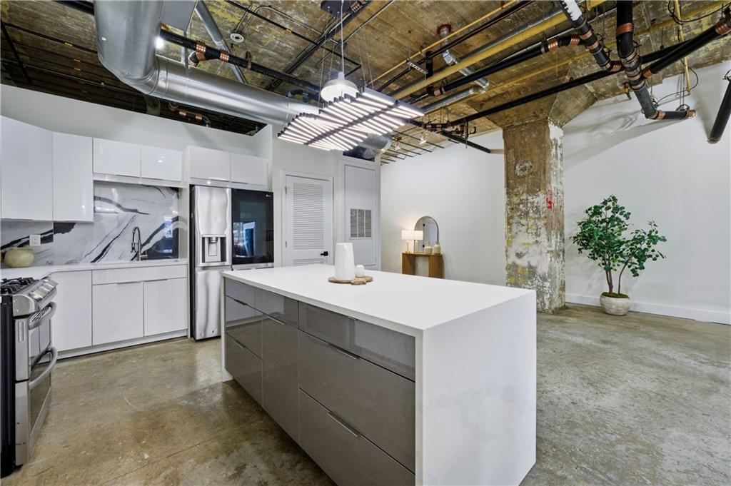 505 Whitehall Street Southwest, Unit 102 Atlanta, GA 30303 - Photo 12 of 46 a utility room with cabinets washer and dryer