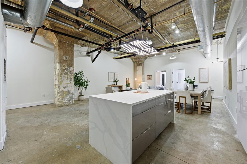 505 Whitehall Street Southwest, Unit 102 Atlanta, GA 30303 - Photo 14 of 46 a view of a kitchen with furniture and a window