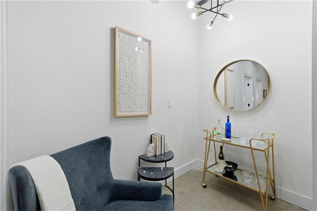 505 Whitehall Street Southwest, Unit 102 Atlanta, GA 30303 - Photo 19 of 46 a room with furniture and a mirror