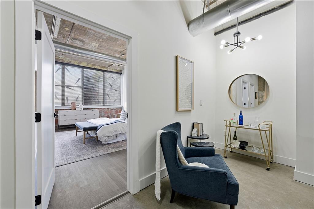 505 Whitehall Street Southwest, Unit 102 Atlanta, GA 30303 - Photo 20 of 46 a living room with furniture and a window