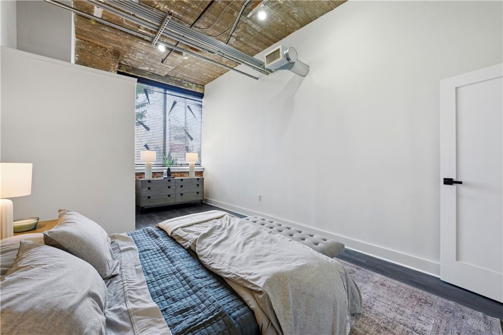 505 Whitehall Street Southwest, Unit 102 Atlanta, GA 30303 - Photo 25 of 46 a bedroom with a bed and a window