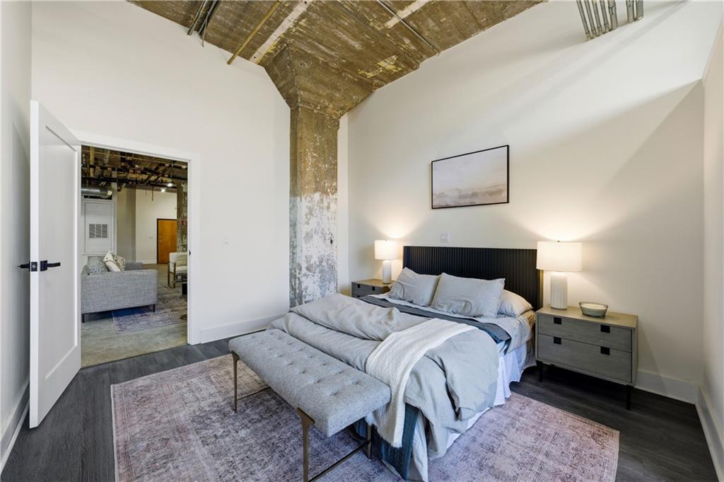 505 Whitehall Street Southwest, Unit 102 Atlanta, GA 30303 - Photo 28 of 46 a bedroom with a bed and a view of bathroom