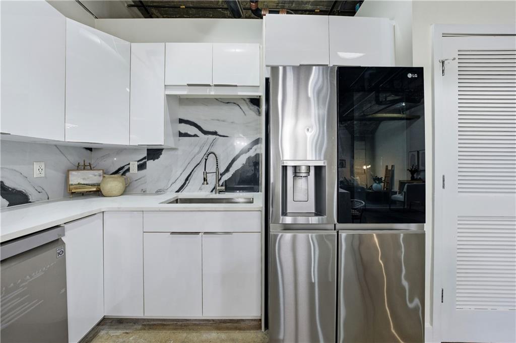 505 Whitehall Street Southwest, Unit 102 Atlanta, GA 30303 - Photo 3 of 46 a kitchen with a sink and cabinets