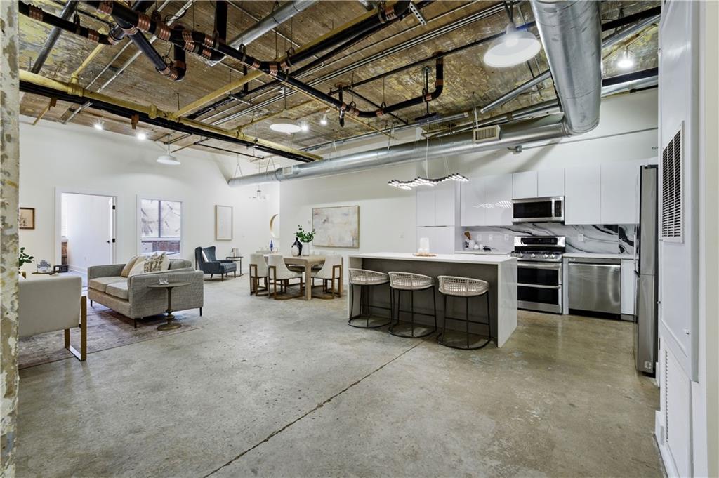 505 Whitehall Street Southwest, Unit 102 Atlanta, GA 30303 - Photo 10 of 46 a view of kitchen with furniture and flat screen tv
