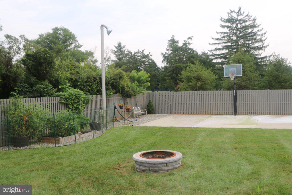 203 Holmes Mill Road Cream Ridge, NJ 08514 - Photo 38 of 58 Firepit and view of lighted sport court