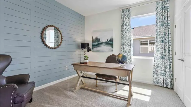 a workspace with furniture and a window