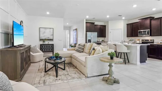 a living room with fireplace furniture and a flat screen tv