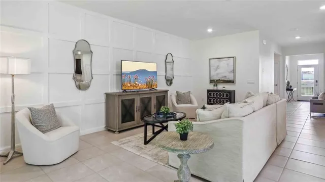 a living room with furniture and a painting