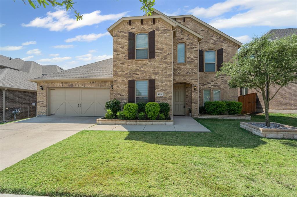 15201 Belclaire Avenue Aledo, TX 76008 - Photo 1 of 1 a front view of a house with a yard and garage