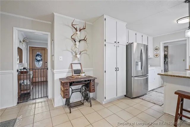 a kitchen with stainless steel appliances a refrigerator and a sink
