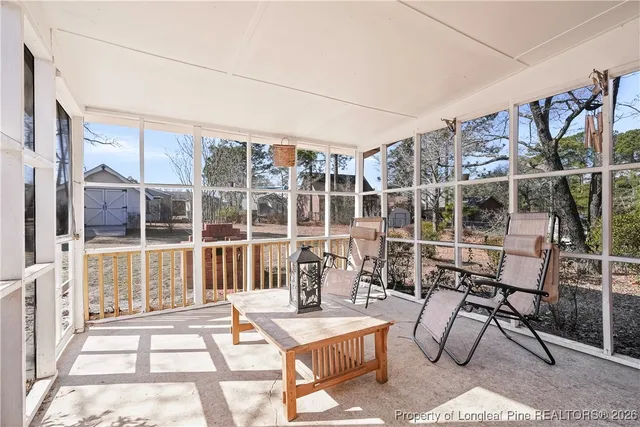 a view of a chairs and table in a patio