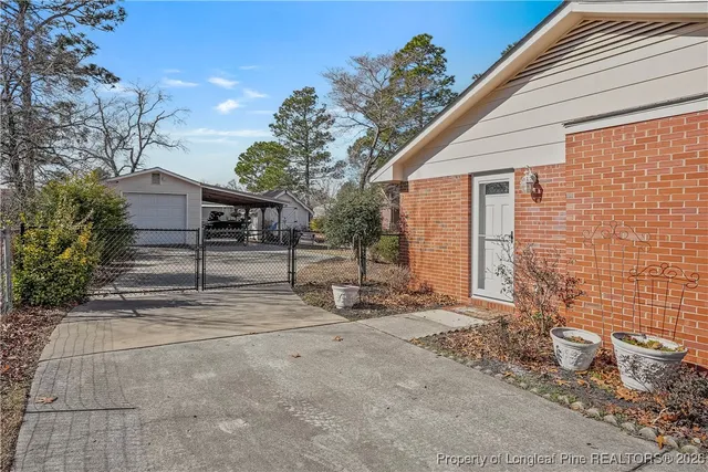 a view of a house with a yard and garage