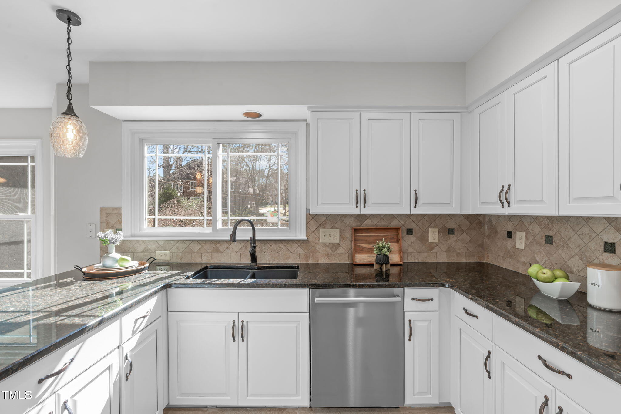 109 Covington Square Drive Cary, NC 27513 - Photo 11 of 41 a kitchen with granite countertop white cabinets white appliances and a sink