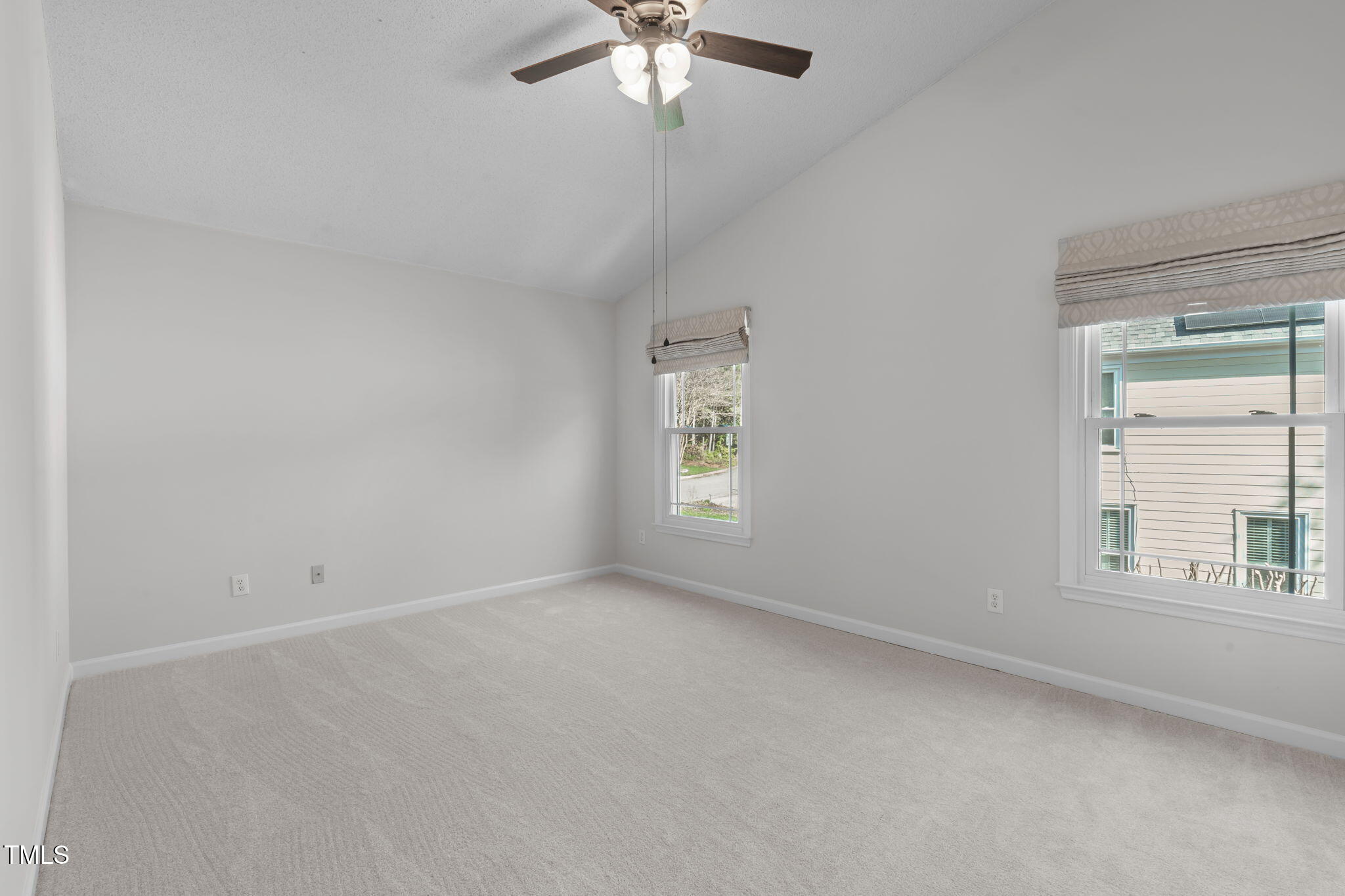 109 Covington Square Drive Cary, NC 27513 - Photo 19 of 41 an empty room with a window and a fan