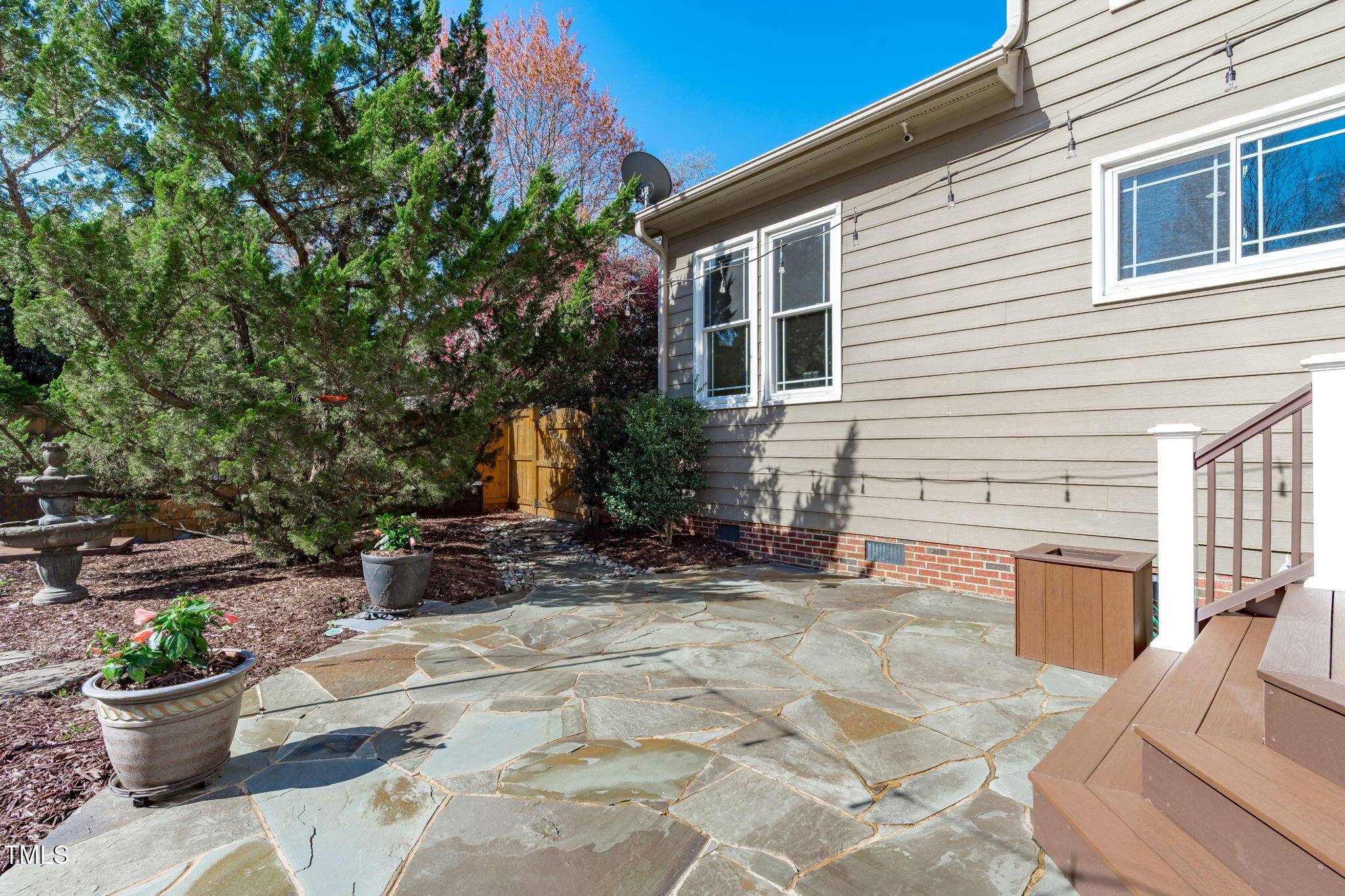 109 Covington Square Drive Cary, NC 27513 - Photo 29 of 41 a view of a patio with chair and potted plants
