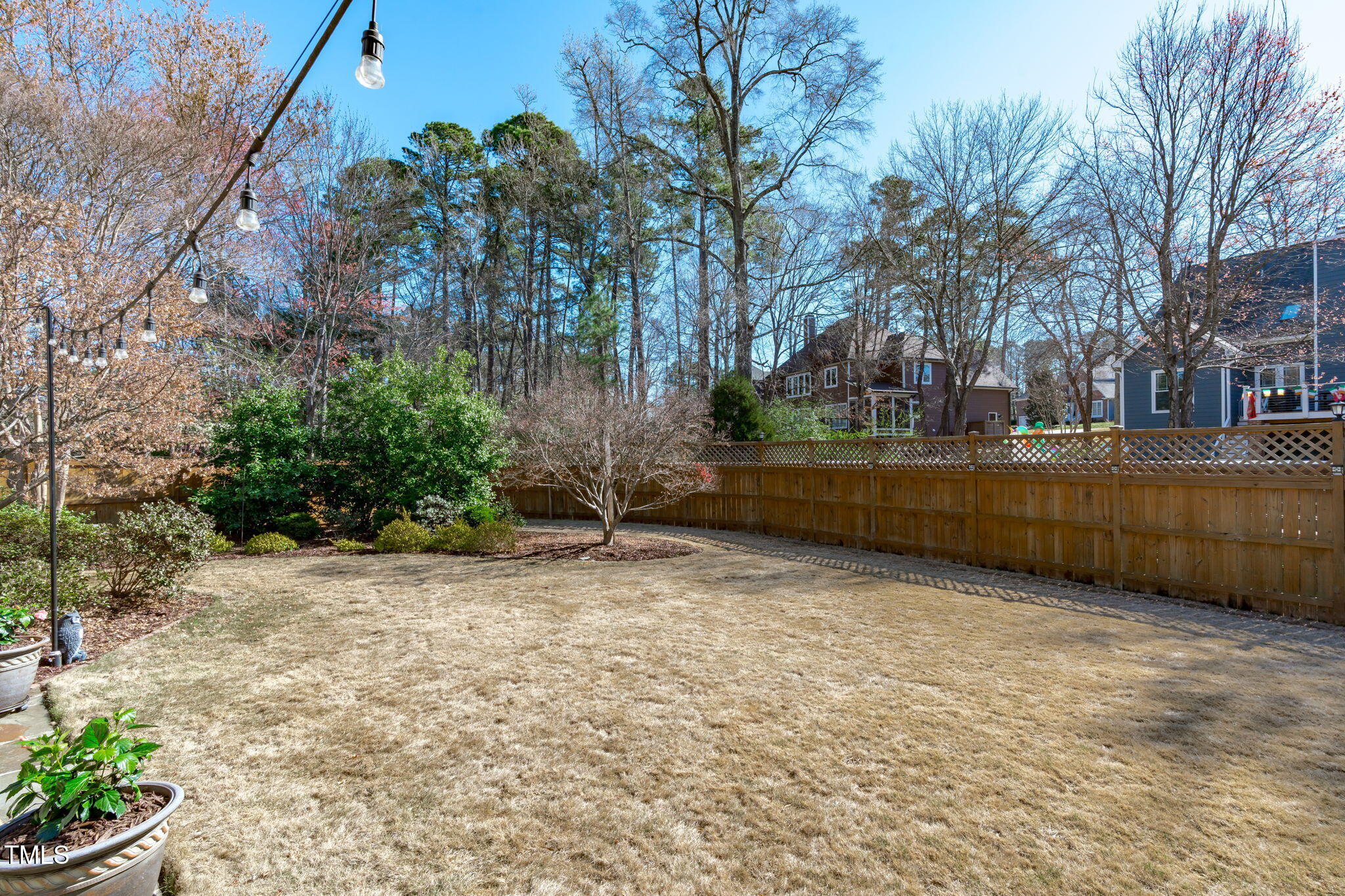 109 Covington Square Drive Cary, NC 27513 - Photo 33 of 41 a backyard of a house with lots of green space