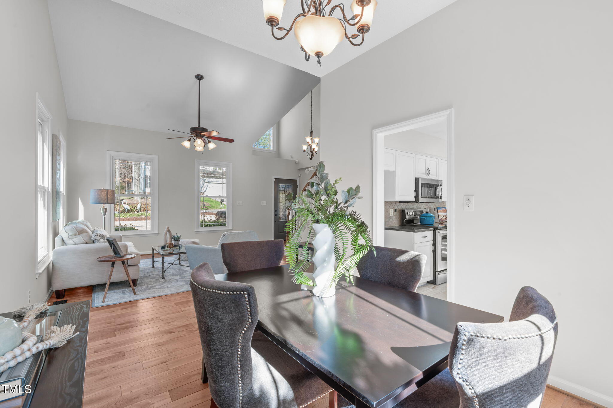 109 Covington Square Drive Cary, NC 27513 - Photo 6 of 41 a view of a dining room with furniture wooden floor and chandelier