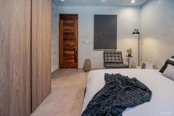 a bed room with a bed and a couch