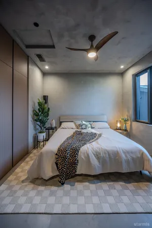 a bedroom with a large bed and a potted plant