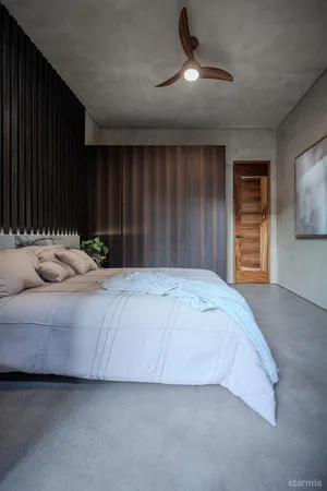 a bedroom with a bed and a walk in closet