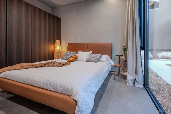 a bedroom with a bed and a cabinets