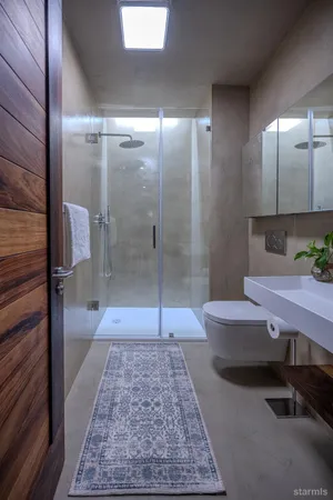 a bathroom with a sink and a shower