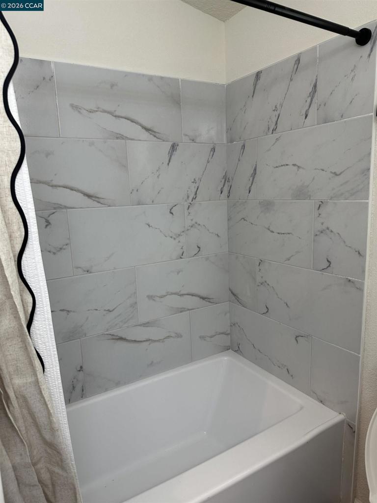 60 Wilson Way Milpitas, CA 95035 - Photo 17 of 22 a bathroom with a bathtub