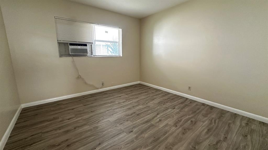 719 Southeast 16th Street, Unit 5 Fort Lauderdale, FL 33316 - Photo 11 of 12 wooden floor in an empty room with a window