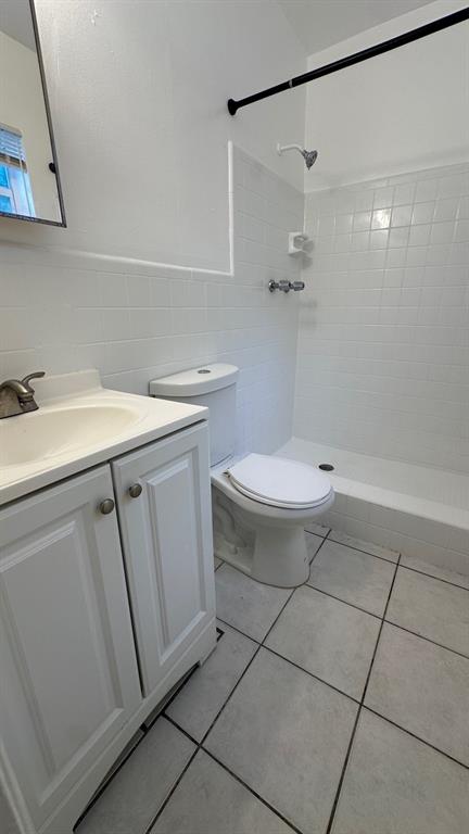 719 Southeast 16th Street, Unit 5 Fort Lauderdale, FL 33316 - Photo 7 of 12 a bathroom with a sink toilet and shower