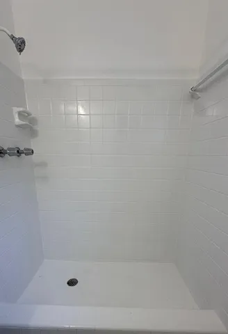 a close up of a bathtub in a bathroom