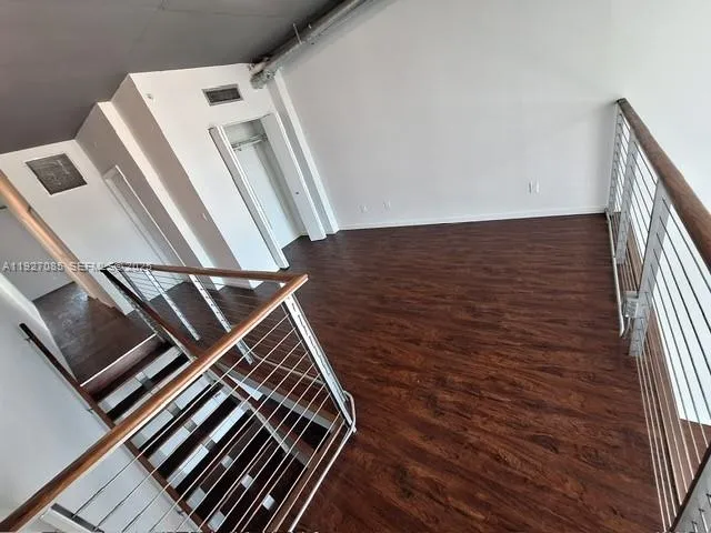 a bathroom with a sink mirror and toilet