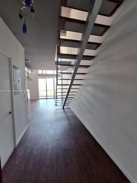 690 Southwest 1st Court, Unit 2711 Miami, FL 33130 - Photo 23 of 26 wooden floor in an empty room with a window