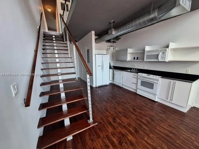 a view of entryway with wooden floor
