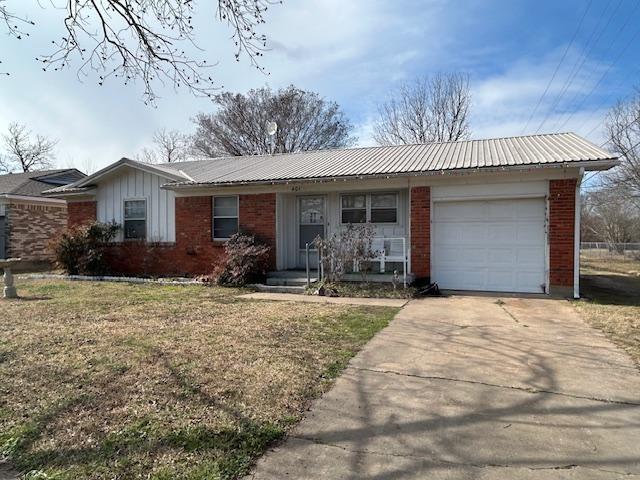 401 South Carter Street Whitewright, TX 75491 - Photo 5 of 5 a front view of house with yard outdoor seating and barbeque oven