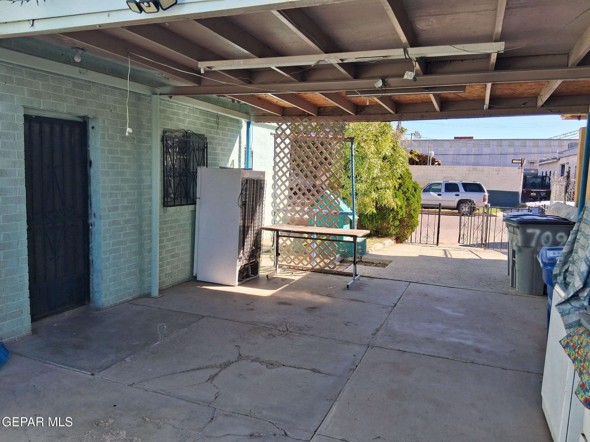 709 South Virginia Street El Paso, TX 79901 - Photo 2 of 12 a view of a porch with furniture and a grill