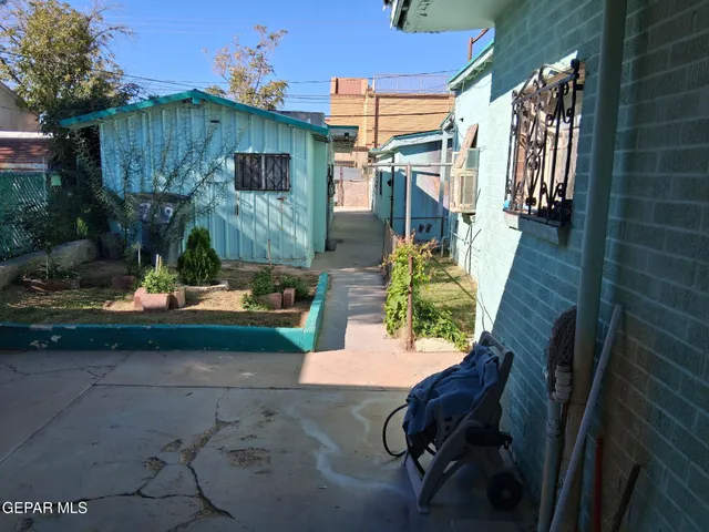 a backyard of a house with outdoor seating