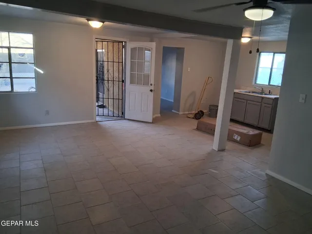 a view of an empty room with a window