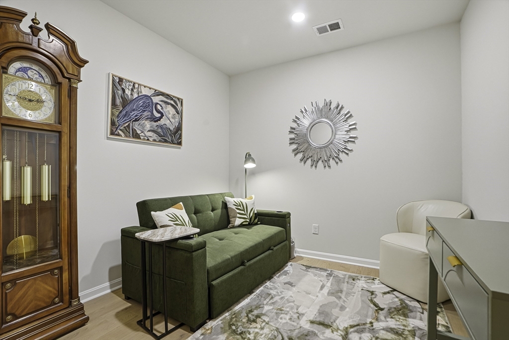 2 Codman Way, Unit 2203 Westborough, MA 01581 - Photo 20 of 36 a living room with furniture and a window